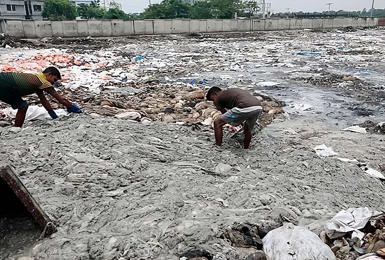 Bangladeshi workers sort through unprocessed leather at Savar Tannery Industrial Estate.